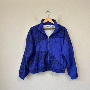 VINTAGE 90s REEBOK Full-Zip Athletic Windbreaker in Blue Geometric